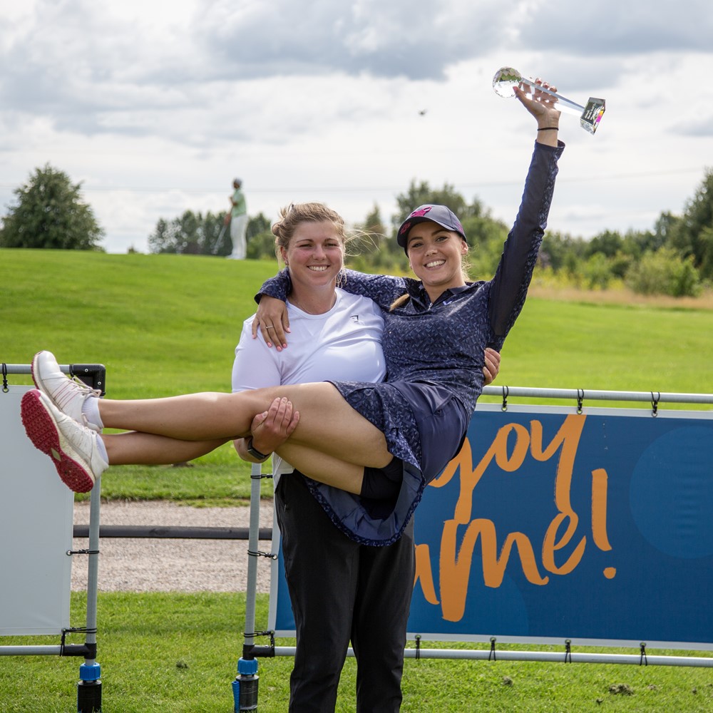 A friend carry Gemma Clews after her victory. Photo: FRANK UNDALL